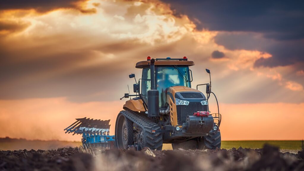 tractor on Illinois farm against sunset