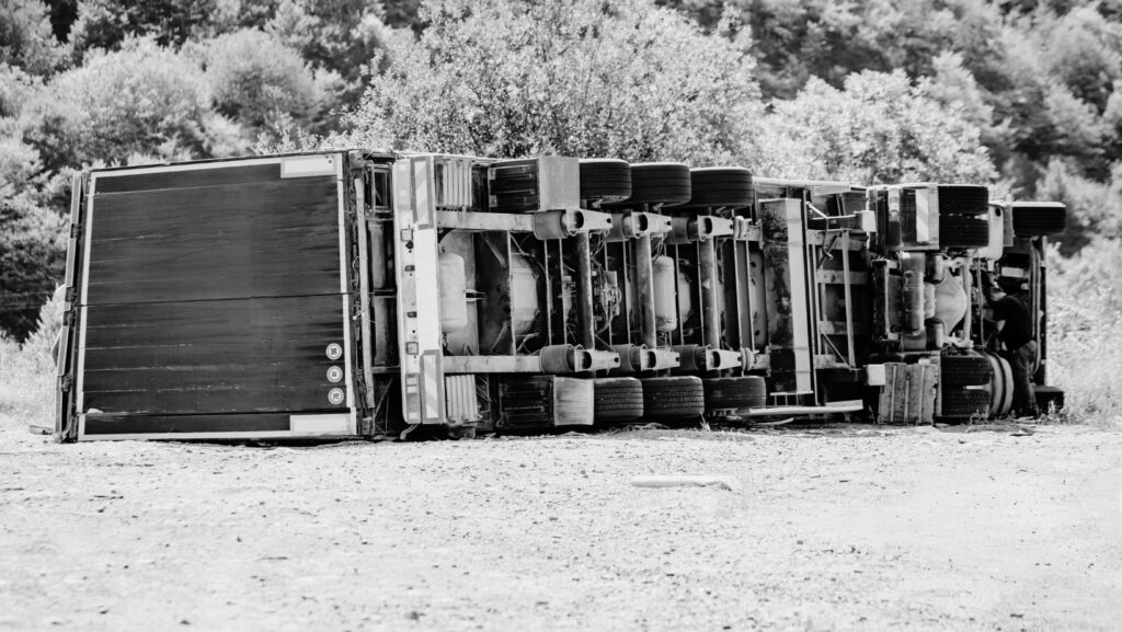 truck accident with truck turned over on its side